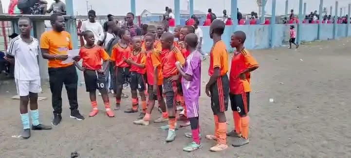 Isaac Brown Jr. coaching youth soccer in Liberia